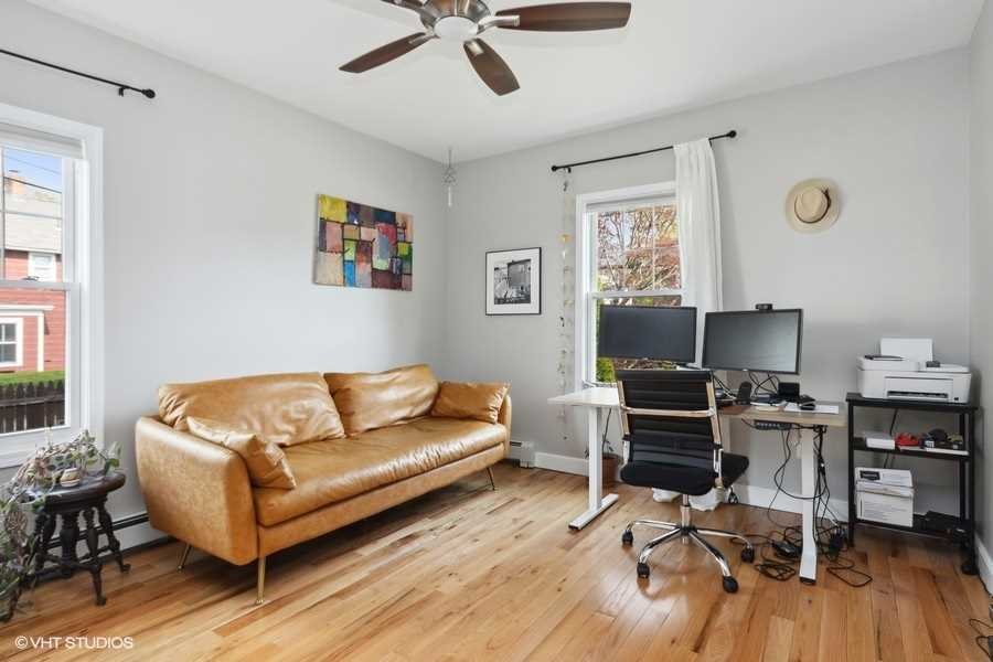 263 Fishkill Avenue Beacon, NY 12508 - Photo 12 of 36 a living room with furniture and a wooden floor