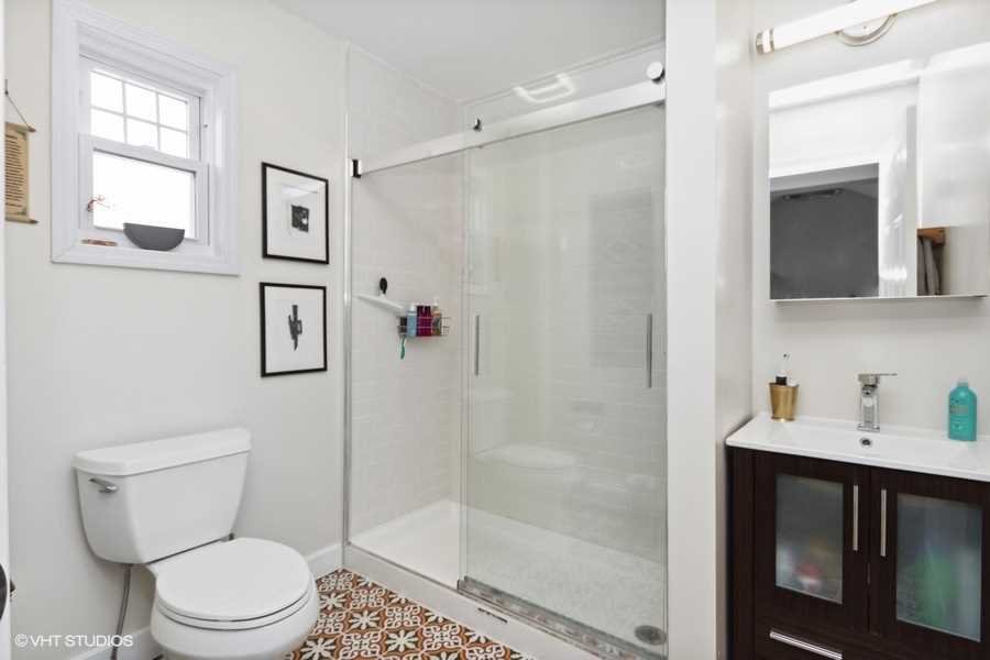 263 Fishkill Avenue Beacon, NY 12508 - Photo 23 of 36 a white toilet sitting next to a bathroom sink