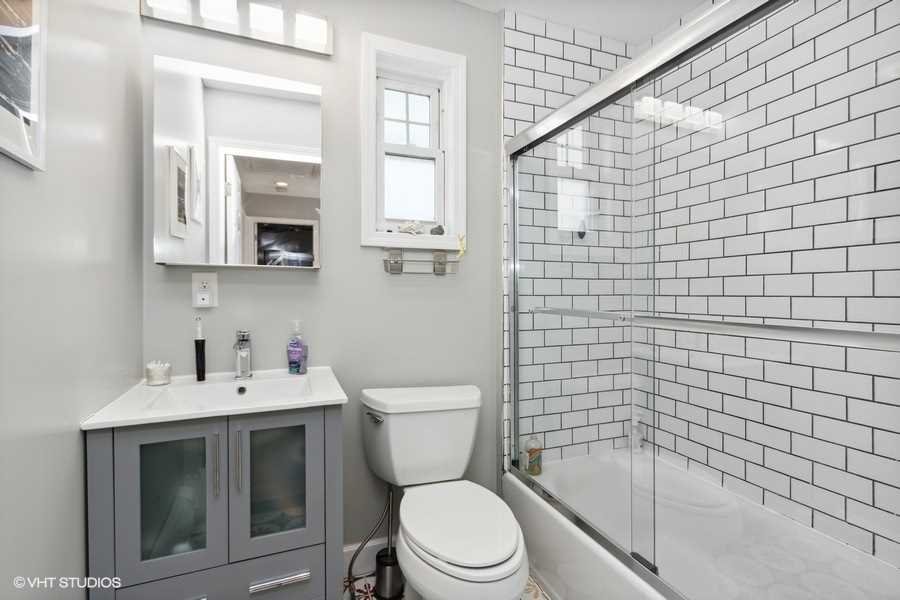 263 Fishkill Avenue Beacon, NY 12508 - Photo 26 of 36 a bathroom with a toilet a sink a mirror and shower