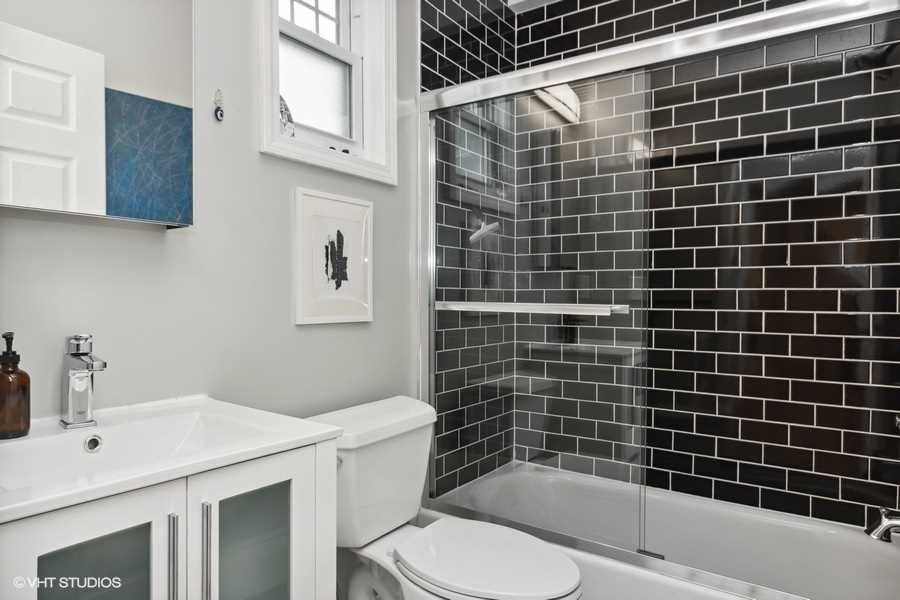 263 Fishkill Avenue Beacon, NY 12508 - Photo 10 of 36 a bathroom with a sink a toilet and shower