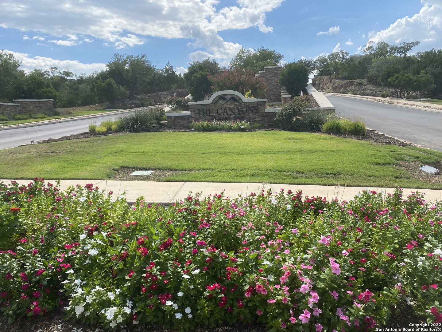 24510 Paraiso Ridge San Antonio, TX 78255 - Photo 11 of 11 a view of a garden with a building in the background