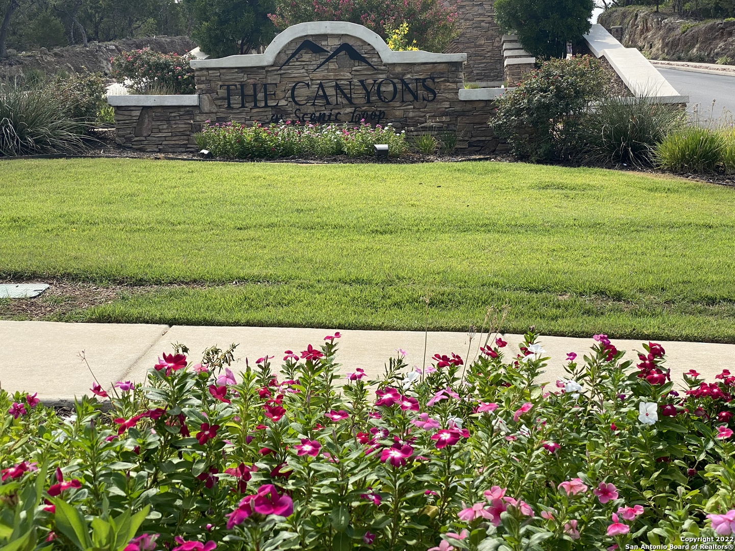 24510 Paraiso Ridge San Antonio, TX 78255 - Photo 2 of 11 a view of bunch of flowers in front of house