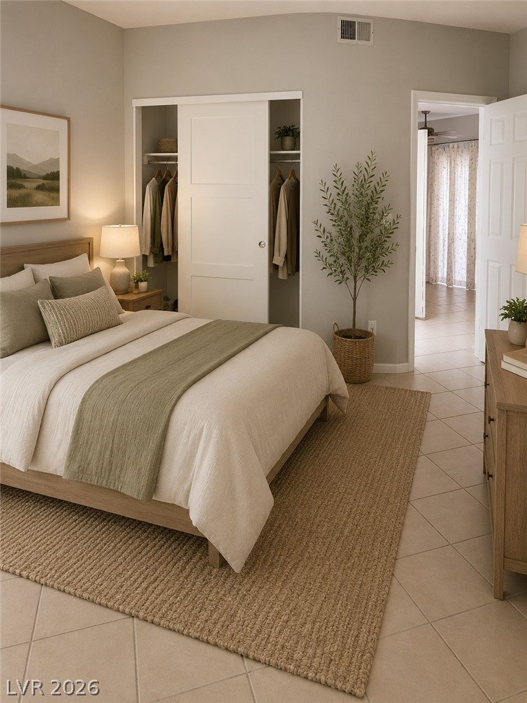 346 Seine Way Henderson, NV 89014 - Photo 8 of 24 Relax in a comfortable bedroom featuring a convenient sliding door closet and durable tile flooring.