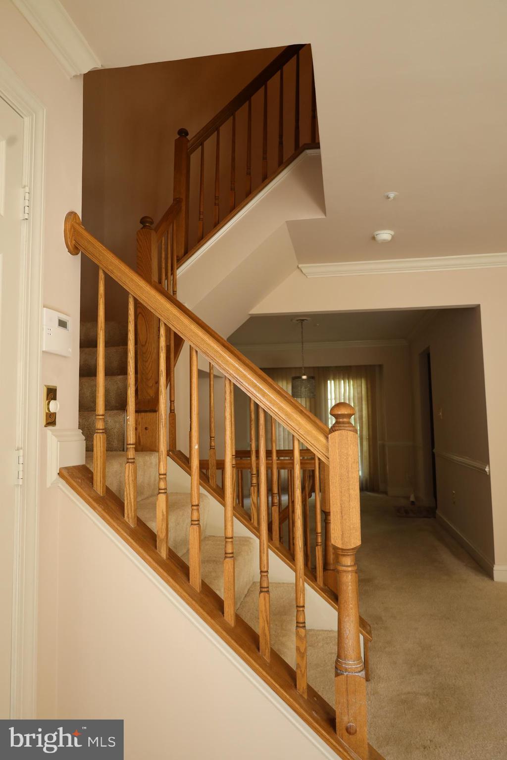 11223 Watermill Lane Silver Spring, MD 20902 - Photo 14 of 39 a view of staircase with railing and white walls