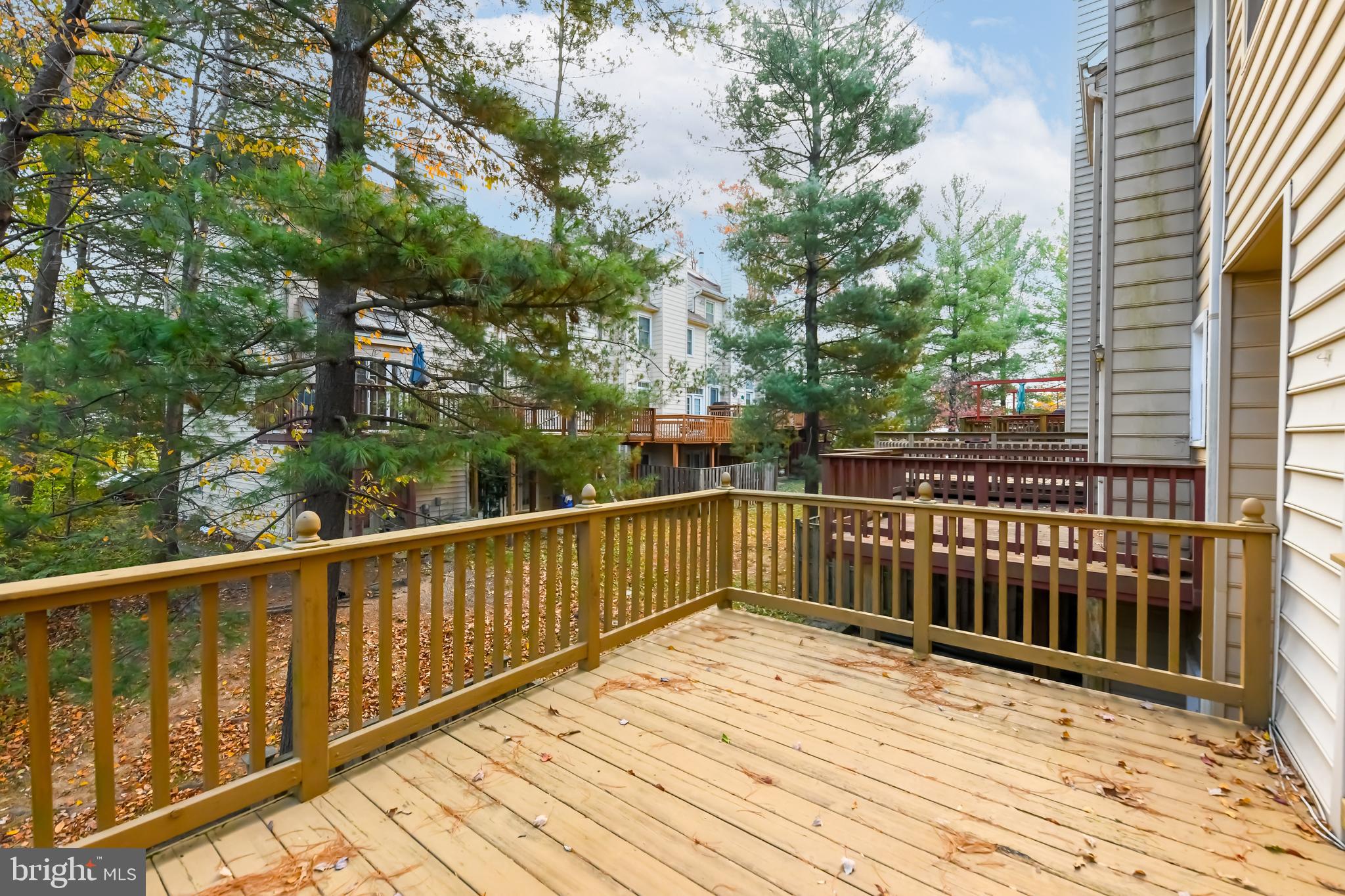11223 Watermill Lane Silver Spring, MD 20902 - Photo 21 of 39 a view of balcony with wooden floor and fence