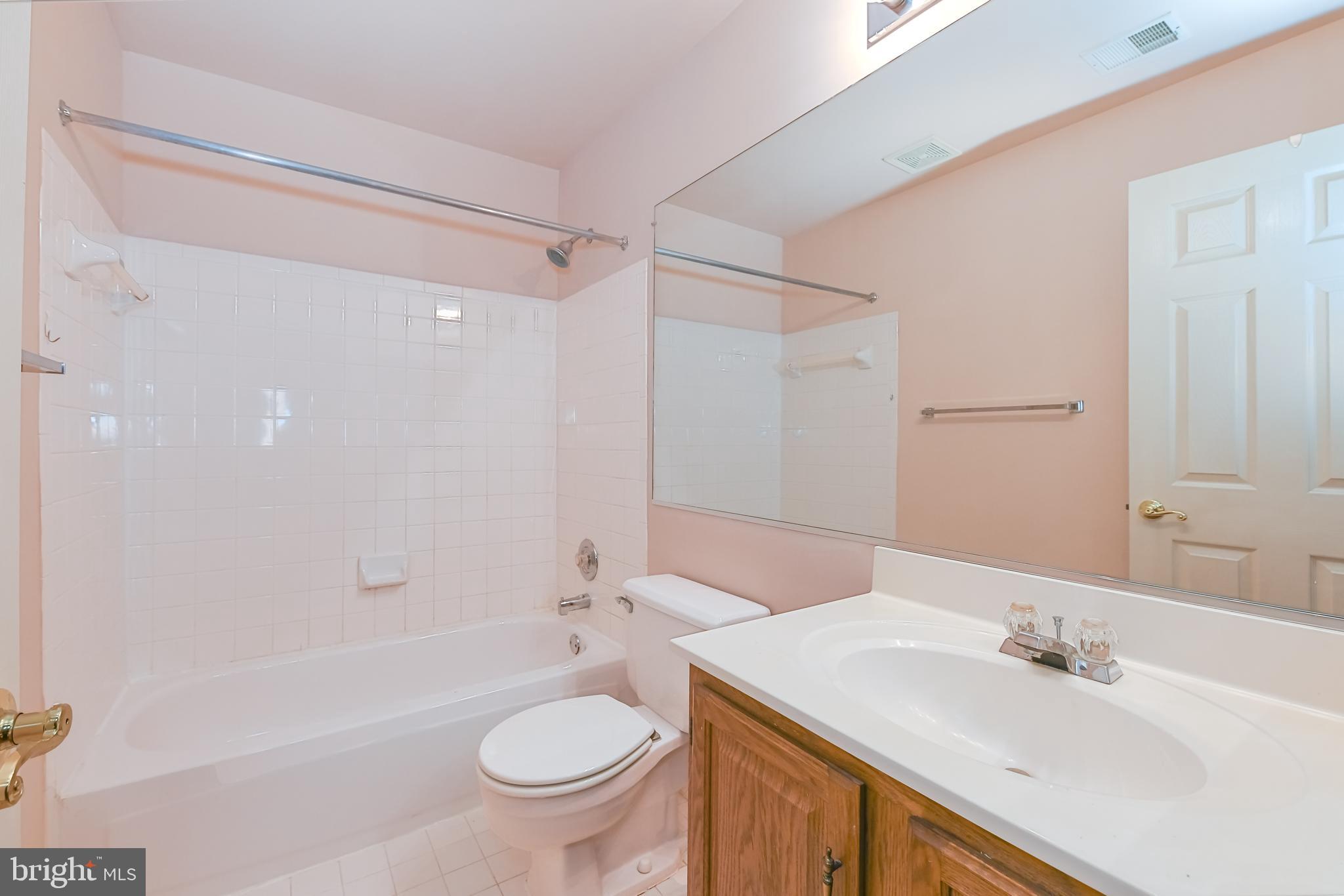 11223 Watermill Lane Silver Spring, MD 20902 - Photo 31 of 39 a bathroom with a sink toilet and shower