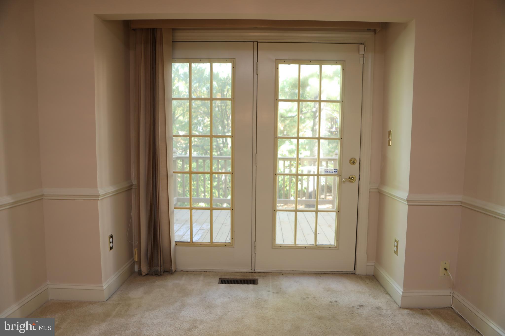 11223 Watermill Lane Silver Spring, MD 20902 - Photo 4 of 39 a view of an empty room with a window