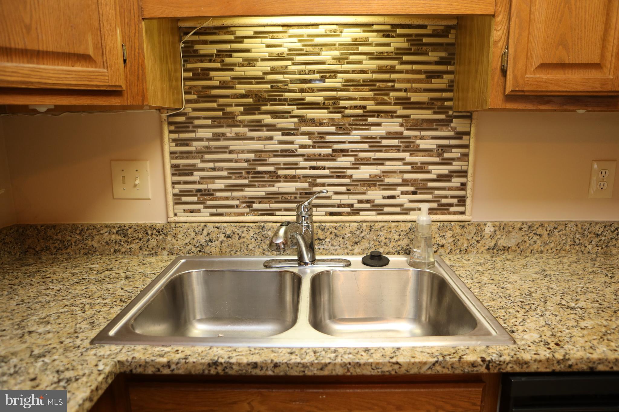11223 Watermill Lane Silver Spring, MD 20902 - Photo 8 of 39 a close view of sink and tap