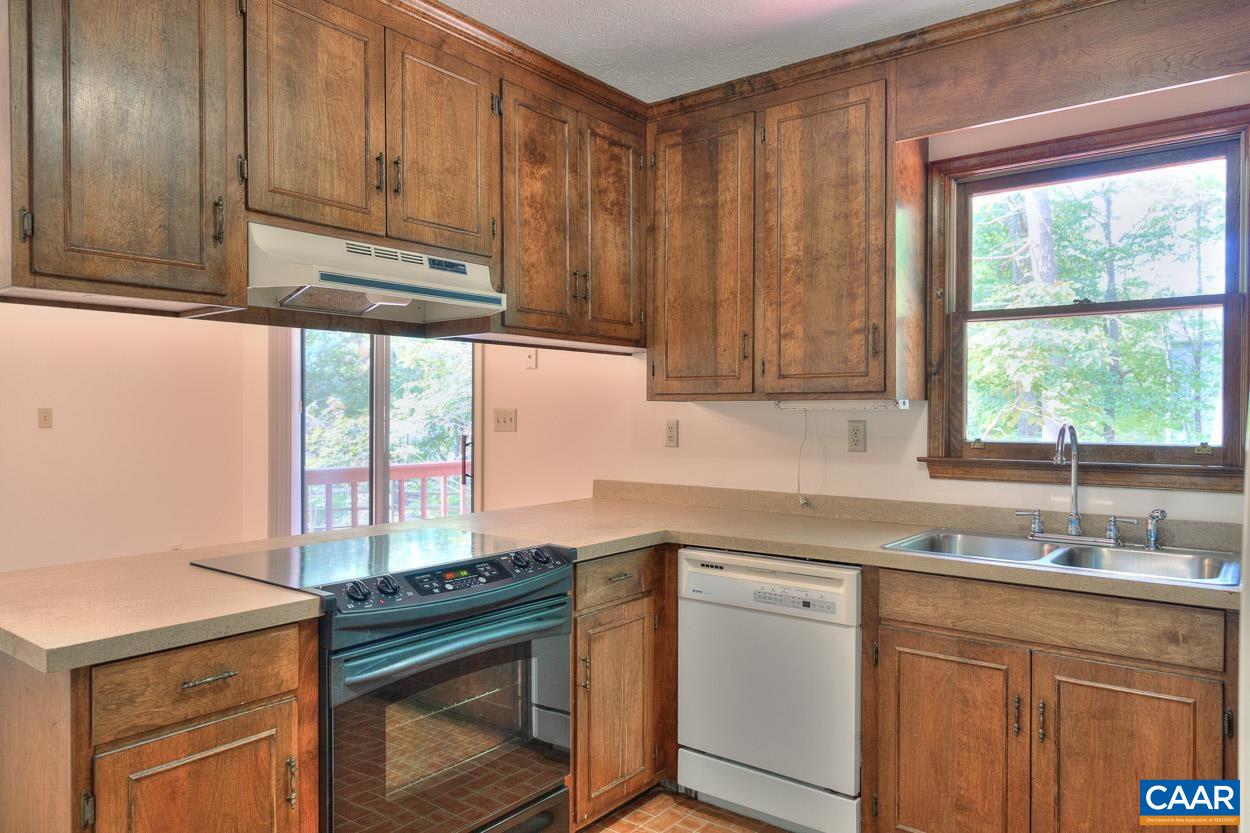 12 Begum Road Palmyra, VA 22963 - Photo 11 of 30 a kitchen with a sink cabinets appliances and a window