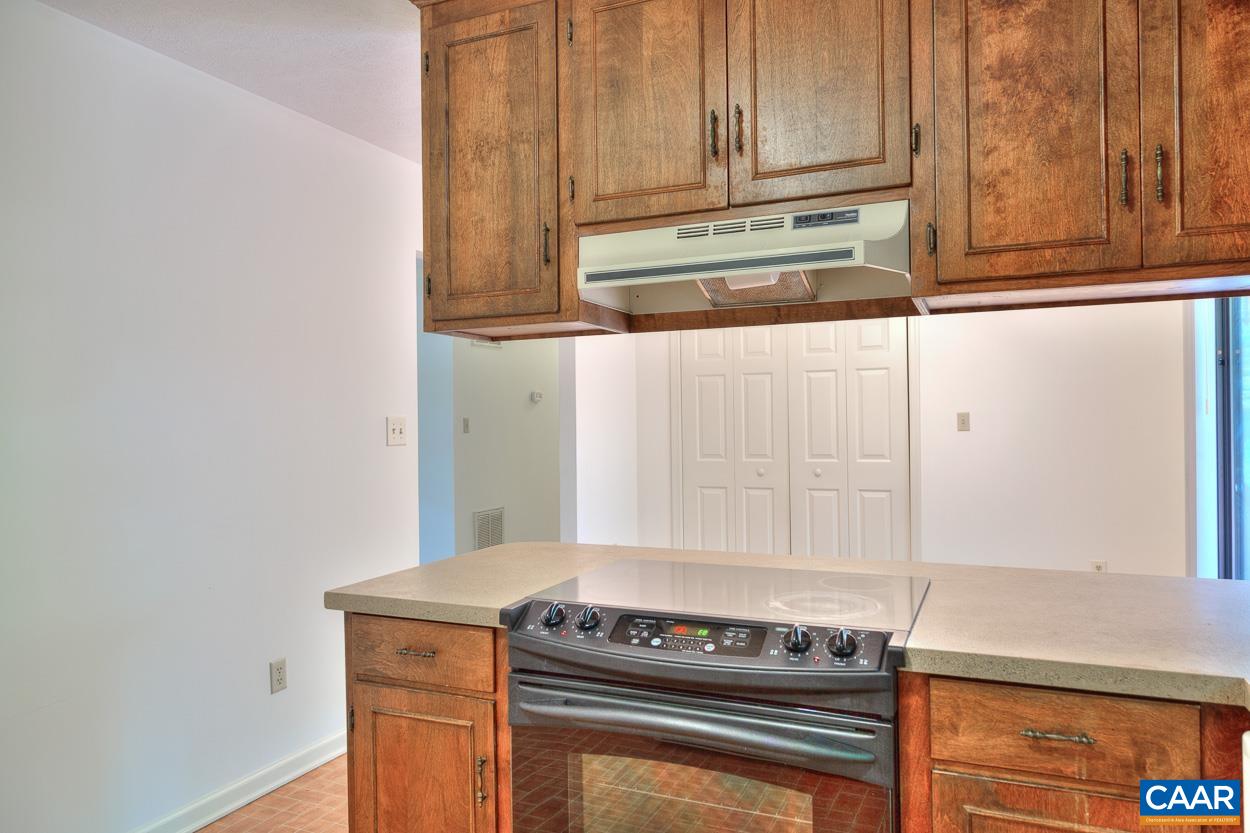 12 Begum Road Palmyra, VA 22963 - Photo 12 of 30 a kitchen with wooden cabinets and a stove top oven