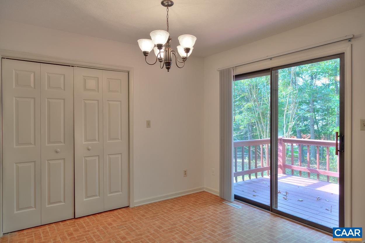 12 Begum Road Palmyra, VA 22963 - Photo 8 of 30 a view of a livingroom with a chandelier curtains and large windows