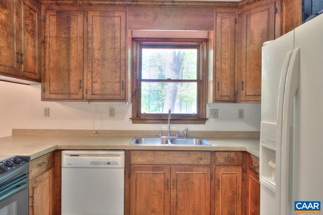 12 Begum Road Palmyra, VA 22963 - Photo 10 of 30 a kitchen with stainless steel appliances granite countertop a refrigerator sink and cabinets