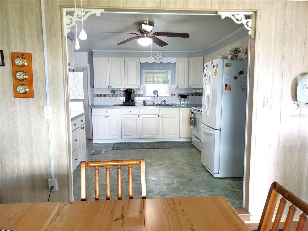 176 West Manatee Loop Punta Gorda, FL 33950 - Photo 16 of 63 a kitchen with stainless steel appliances granite countertop a refrigerator and a sink