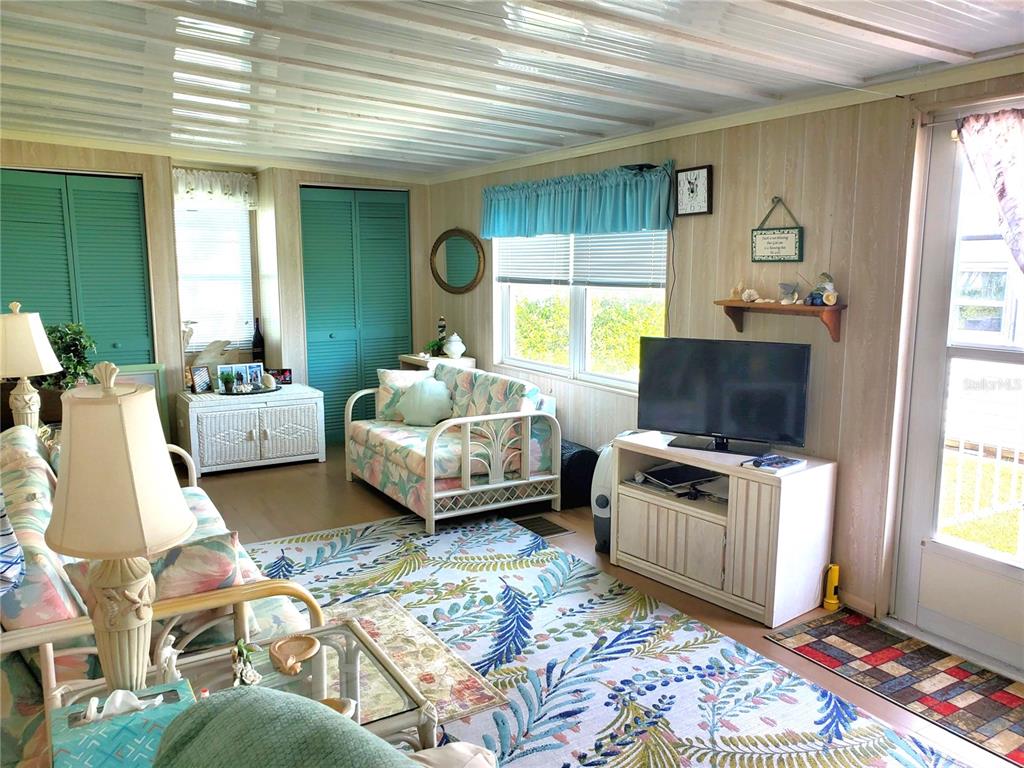 176 West Manatee Loop Punta Gorda, FL 33950 - Photo 19 of 63 a bedroom with furniture and a window