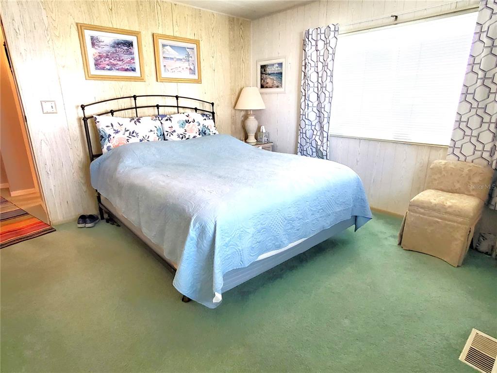 176 West Manatee Loop Punta Gorda, FL 33950 - Photo 20 of 63 a bedroom with a bed and window