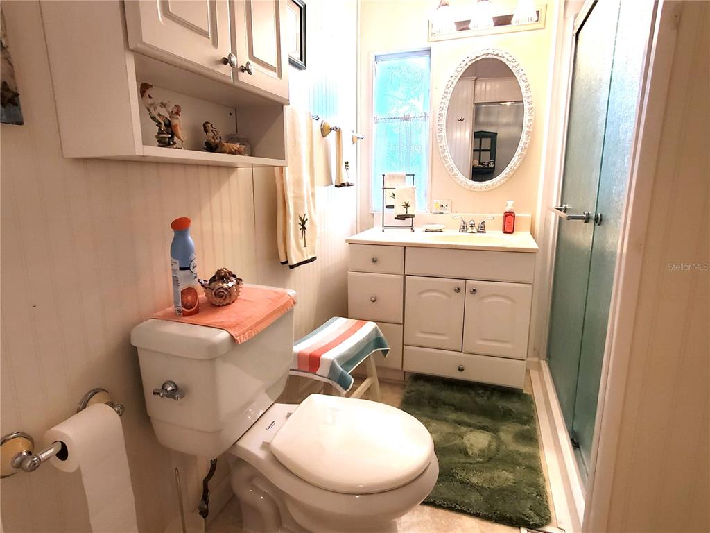 176 West Manatee Loop Punta Gorda, FL 33950 - Photo 23 of 63 a bathroom with a toilet sink and mirror