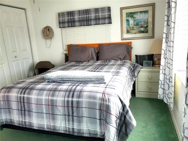 a bathroom with a window a sink and a toilet