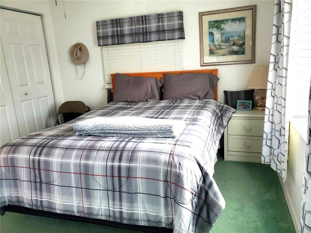 176 West Manatee Loop Punta Gorda, FL 33950 - Photo 25 of 63 a bedroom with a bed and a window