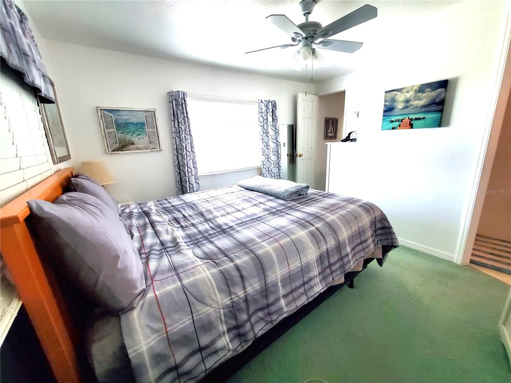 176 West Manatee Loop Punta Gorda, FL 33950 - Photo 26 of 63 a bedroom with a bed and a window