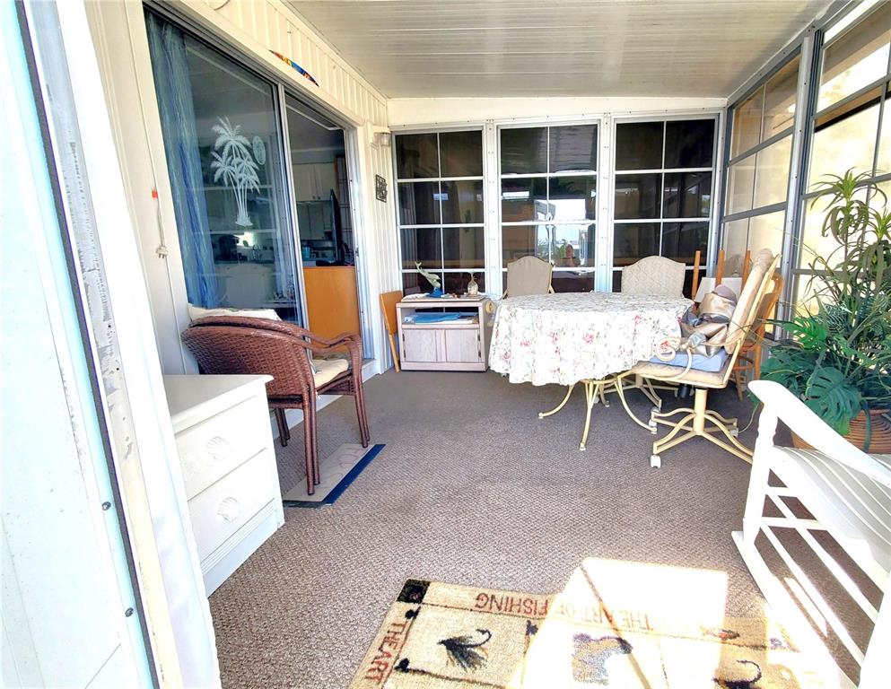 176 West Manatee Loop Punta Gorda, FL 33950 - Photo 29 of 63 a living room with furniture and a large window