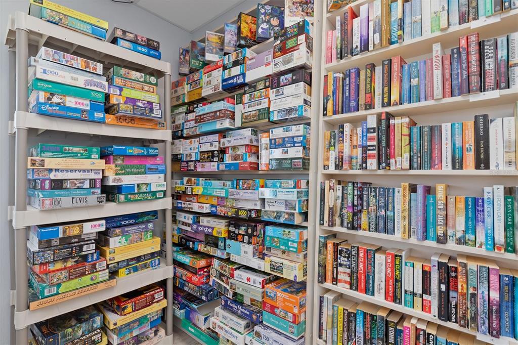 176 West Manatee Loop Punta Gorda, FL 33950 - Photo 32 of 63 a book shelf with books and a book shelf