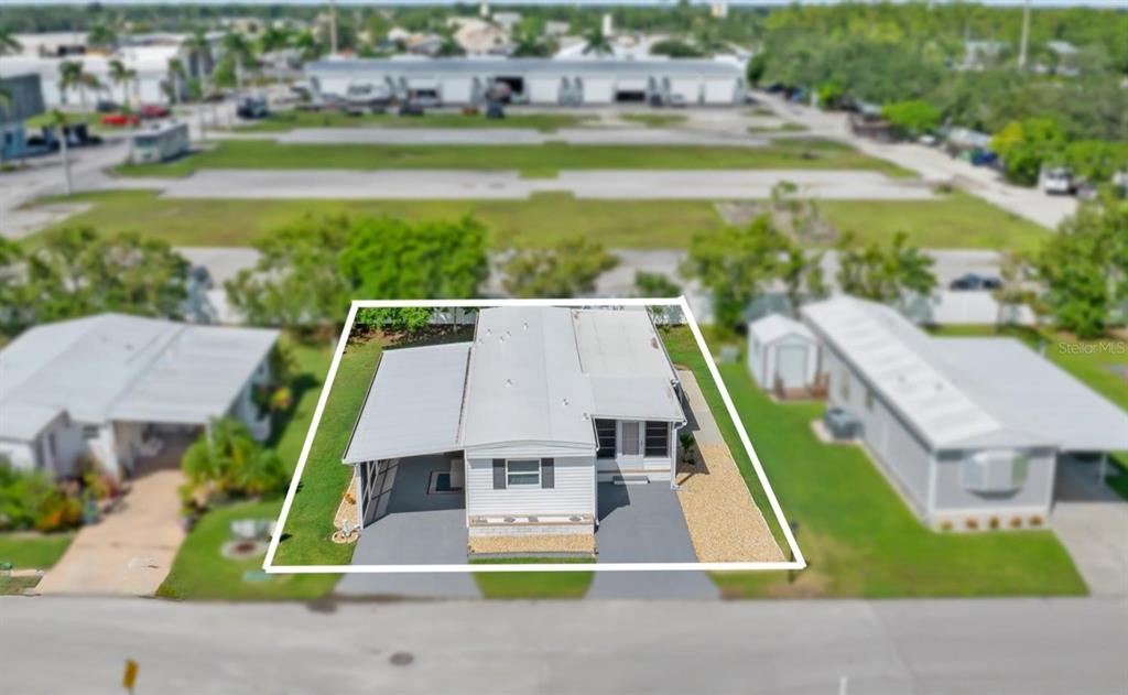 176 West Manatee Loop Punta Gorda, FL 33950 - Photo 58 of 63 an aerial view of a house with a garden