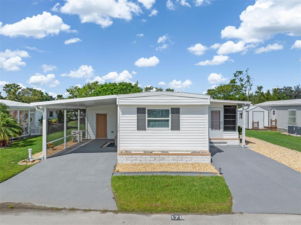 176 West Manatee Loop Punta Gorda, FL 33950 - Photo 7 of 63 a view of a house with a yard