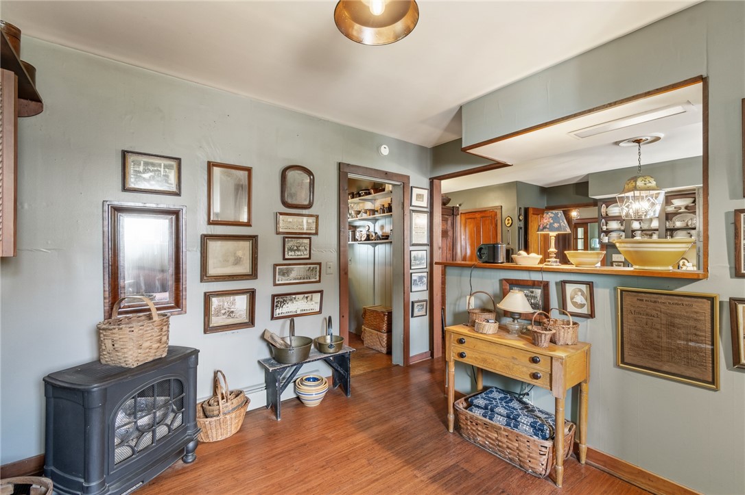 4007 Ridge Road Williamson, NY 14589 - Photo 12 of 34 Here’s another view of the sitting room of pf the kitchen- or use as a dinette are if you’d prefer! This circa 1900s home offers original REAL WOOD flooring and a mix of newer EASY CARE flooring!
