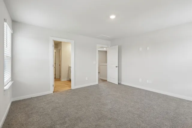 a bathroom with a double vanity sink and mirror