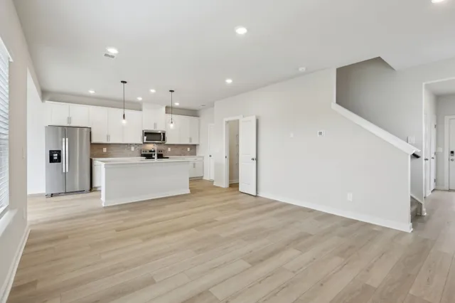 a view of kitchen with wooden floor