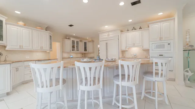 a kitchen with a sink cabinets and window