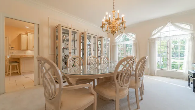 a kitchen with a refrigerator and a stove top oven