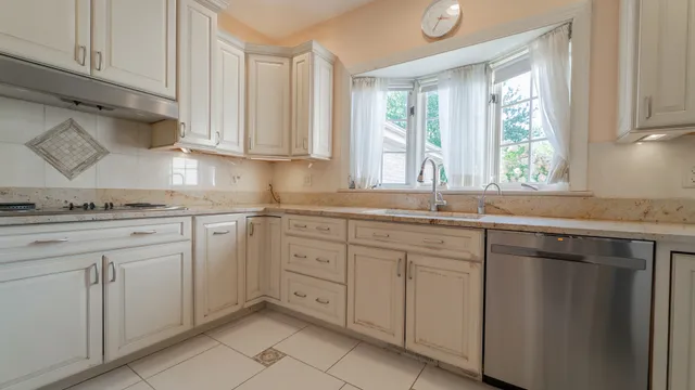 a spacious bedroom with a large bed and a large window