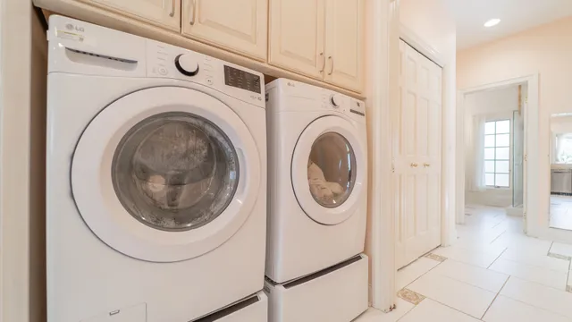 a bathroom with a sink a light fixture and a mirror