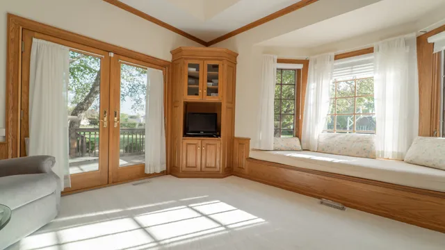 a spacious bedroom with a bed and a couch