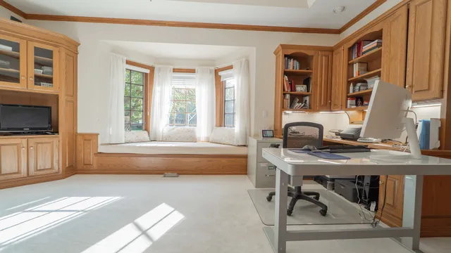 a large white bed in a white room