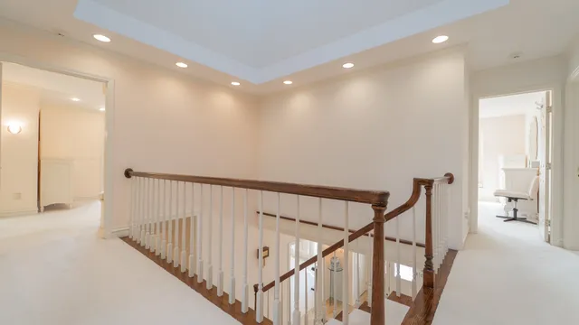 a bath tub sitting in a bathroom next to a window
