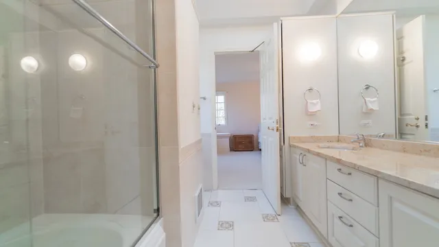 a bedroom with a bed and a chair