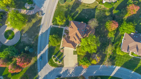 an aerial view of house with yard