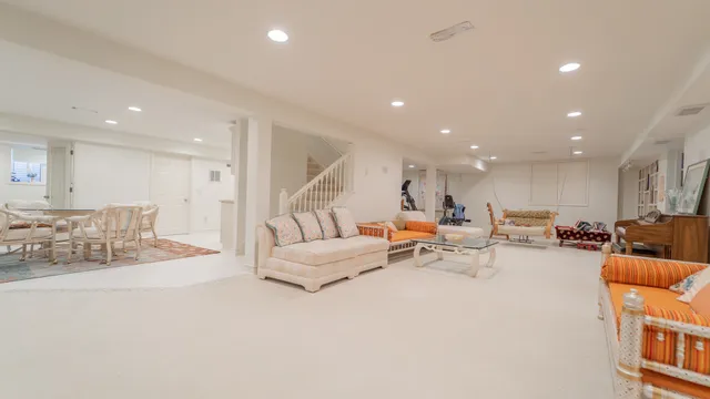 a dining table with chairs and window