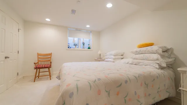 a view of a house with a big yard and large trees