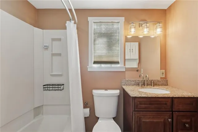 a bathroom with a toilet a sink and a bathtub