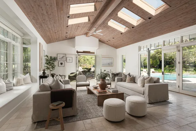 a view of a dining room with furniture and window