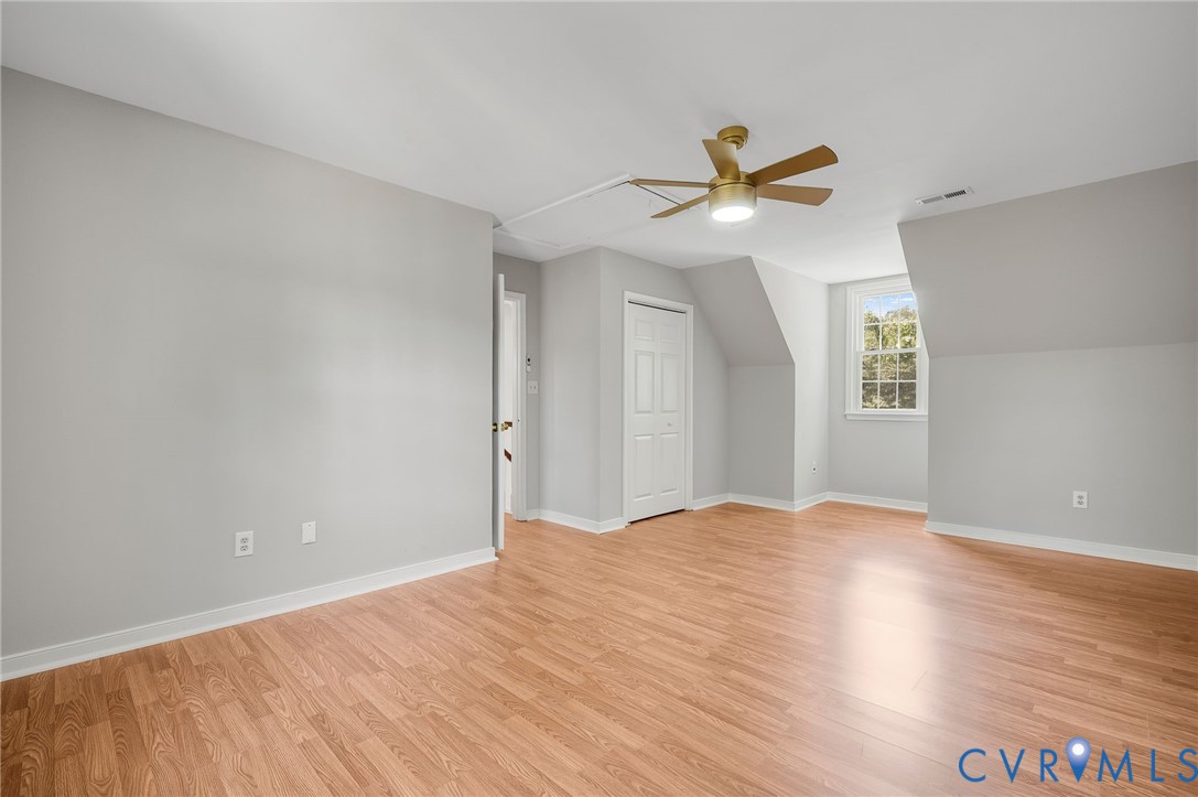 10110 Holly Road Mechanicsville, VA 23116 - Photo 26 of 26 Spacious room featuring wood-finish flooring, ligh