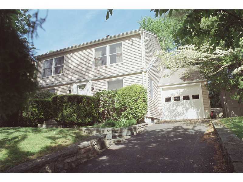 23 Hoover Road Riverside, CT 06878 - Photo 1 of 18 a front view of a house with a yard