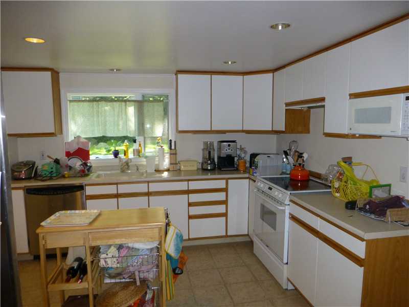 23 Hoover Road Riverside, CT 06878 - Photo 7 of 18 a kitchen with a sink cabinets and wooden floor
