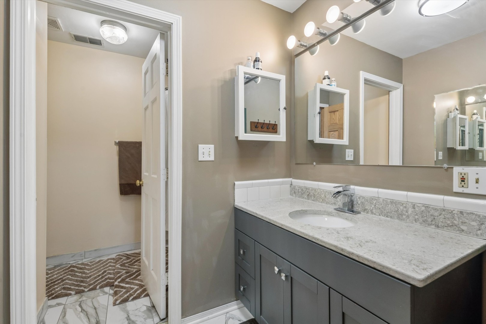2142 North Summit Street Wheaton, IL 60187 - Photo 19 of 35 a bathroom with a granite countertop sink and a mirror