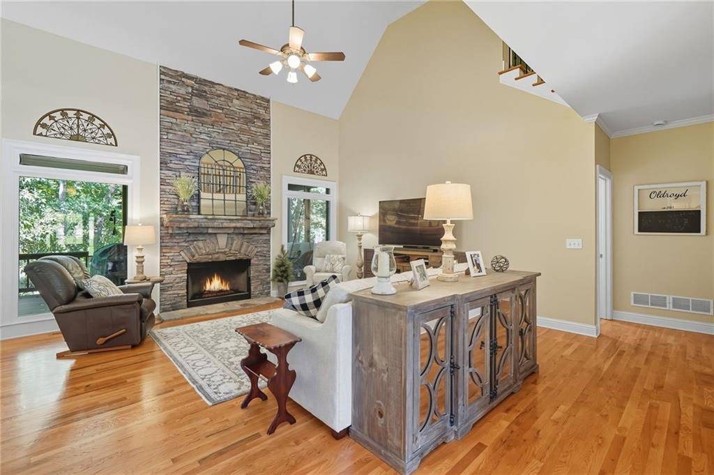 208 North Ridgeview Court Canton, GA 30115 - Photo 15 of 59 a living room with furniture a fireplace and a table