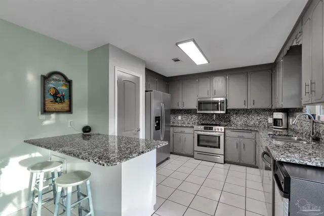 a white bath tub sitting next to a white toilet