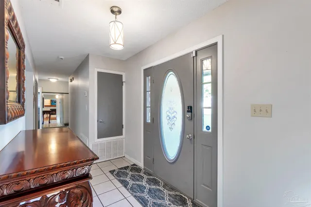 a view of a livingroom with furniture and a workspace